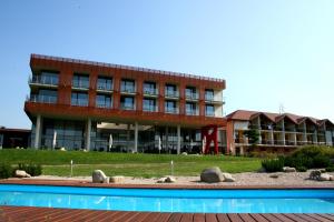 The swimming pool at or close to K-Triumf Resort