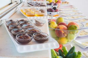 a buffet filled with different types of fruits and desserts at Miramar Pansiyon in Kaş