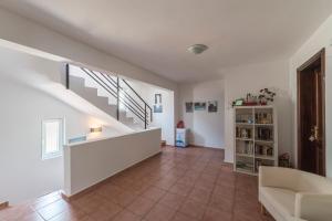 a living room with a staircase and a couch at Miramar Pansiyon in Kaş