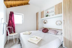 Ein Bett oder Betten in einem Zimmer der Unterkunft Villa Romana