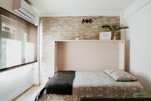 Posteľ alebo postele v izbe v ubytovaní Sol Ohana Apartamento Boutique
