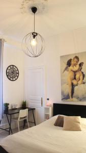 Postel nebo postele na pokoji v ubytování Chambres Privatives Chez l'Habitant