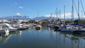 a bunch of boats are docked in a marina at Bungalow au centre-ville de Saint-Pierre terrasse et parking privé in Saint-Pierre