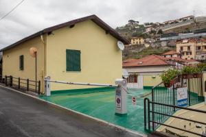 a house with a flooded street in front of it at Casa delle Ginestre Bike in Sanremo