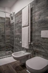 a bathroom with a toilet and a shower at Casa delle Ginestre Bike in Sanremo