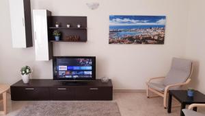 A television and/or entertainment centre at Assarotti Centre Apartment