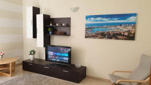 A television and/or entertainment centre at Assarotti Centre Apartment