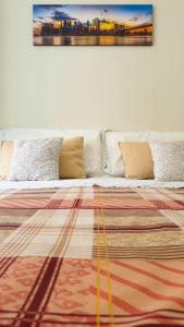 A bed or beds in a room at Assarotti Centre Apartment
