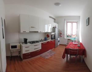 A kitchen or kitchenette at Assarotti Centre Apartment Még 9 kép