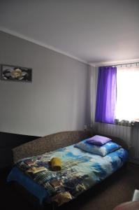 Łóżko lub łóżka w pokoju w obiekcie Zajazd pod Lwem