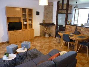 a living room with a couch and a table at Gîte altzia haut in Saint-Michel