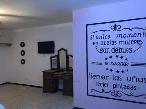 a sign on a wall in a room at Apartamento&Habitación Galeana in Ciudad Valles