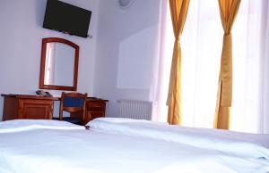 Kőkapu Vadászkastély és Hotel & Apartments客房内的一张或多张床位