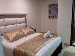 Postel nebo postele na pokoji v ubytování Hotel San Antonio Guarne
