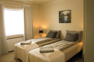מיטה או מיטות בחדר ב-Siddy Apartment