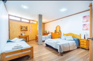 a bedroom with two beds in a room at Casa Roque Aguayro in Agüimes +62 photos