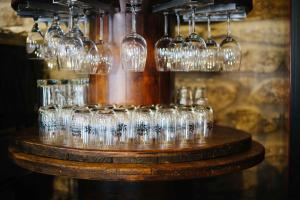 a group of wine glasses sitting on a table at Hotel Arco de Mazarelos in Santiago de Compostela