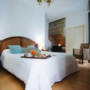 Ένα ή περισσότερα κρεβάτια σε δωμάτιο στο Hotel Arco de Mazarelos
