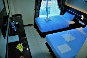 Letto o letti in una camera di Wave View Hotel