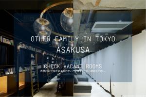 a store window with a sign that reads other family in tokyo asahi at Book And Bed Tokyo Shinjuku in Tokyo