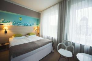Posteľ alebo postele v izbe v ubytovaní Hotel Cristal Białystok