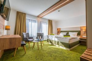 Postel nebo postele na pokoji v ubytování Hotel-Pension Treppengasse Nr 6 + 28 fotografií