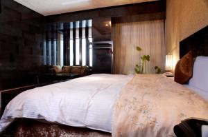 Ένα ή περισσότερα κρεβάτια σε δωμάτιο στο I DO Motel