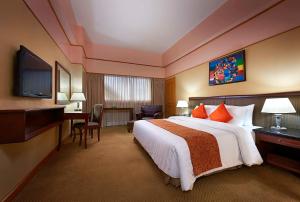 Cama ou camas em um quarto em Hotel IVY Residency