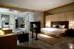 Ένα ή περισσότερα κρεβάτια σε δωμάτιο στο I DO Motel