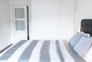 Postel nebo postele na pokoji v ubytování Supeluse-Strassel Beach Apartment