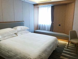 Cama o camas de una habitación en Ruicheng Hotel