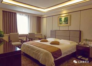 Cama o camas de una habitación en Ruicheng Hotel
