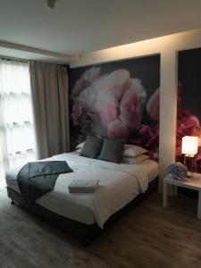 Postel nebo postele na pokoji v ubytování V Garden Hotel
