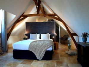 מיטה או מיטות בחדר ב-Domaine de la Limetiere