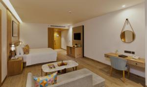 A bed or beds in a room at Country Inn Premier Amritsar - 10 min drive from Golden Temple