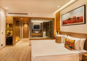 A bed or beds in a room at Country Inn Premier Amritsar - 10 min drive from Golden Temple