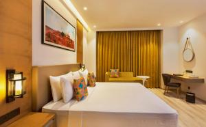 A bed or beds in a room at Country Inn Premier Amritsar - 10 min drive from Golden Temple