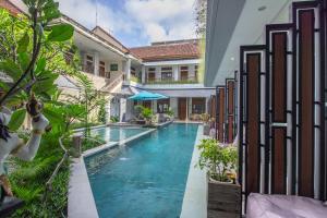 an image of a swimming pool in a villa at Gemini Star Hotel in Kuta