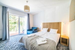 Postel nebo postele na pokoji v ubytování WYDMA Resort Medi & SPA - Normobaria