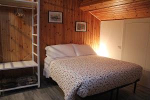 Кровать или кровати в номере La Tegola