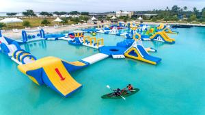 a water park with a bunch of water slides at Solea Mactan Resort and Waterpark in Mactan