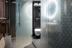 a bathroom with a shower stall and a toilet at Best Western and hotel in Stockholm