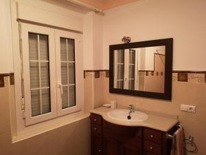 a bathroom with a sink and a mirror at Villa Remedios in Cuevas del Becerro