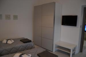 Postel nebo postele na pokoji v ubytování Il profumo dei Sassi Holiday Home
