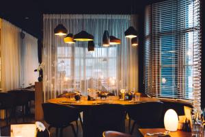 Een restaurant of ander eetgelegenheid bij Boutique Hotel 'Hof ter Duinen'