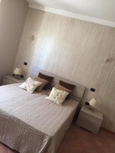 Giường trong phòng chung tại Casa Sù Flamingo