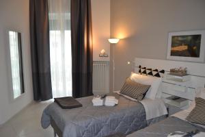 Postel nebo postele na pokoji v ubytování Il profumo dei Sassi Holiday Home