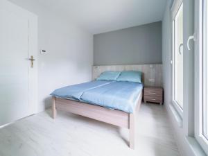 Postel nebo postele na pokoji v ubytování Parkova Apartamenty