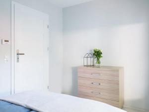 Posteľ alebo postele v izbe v ubytovaní Parkova Apartamenty