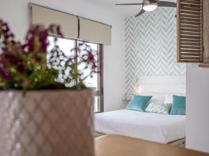 Posteľ alebo postele v izbe v ubytovaní Santa Marina Central Loft by Valcambre